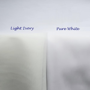 May include: Two fabric swatches, one labeled "Light Ivory" and the other "Pure White". The ivory swatch is a pale yellow color, while the white swatch is a bright white.