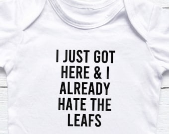 I Just Got Here And I Already Hate The Leafs Baby Onesie®, Hockey Baby Onesie®, Hockey Fan Baby Gift, Flyers Habs Flames Oilers Jets Bruins