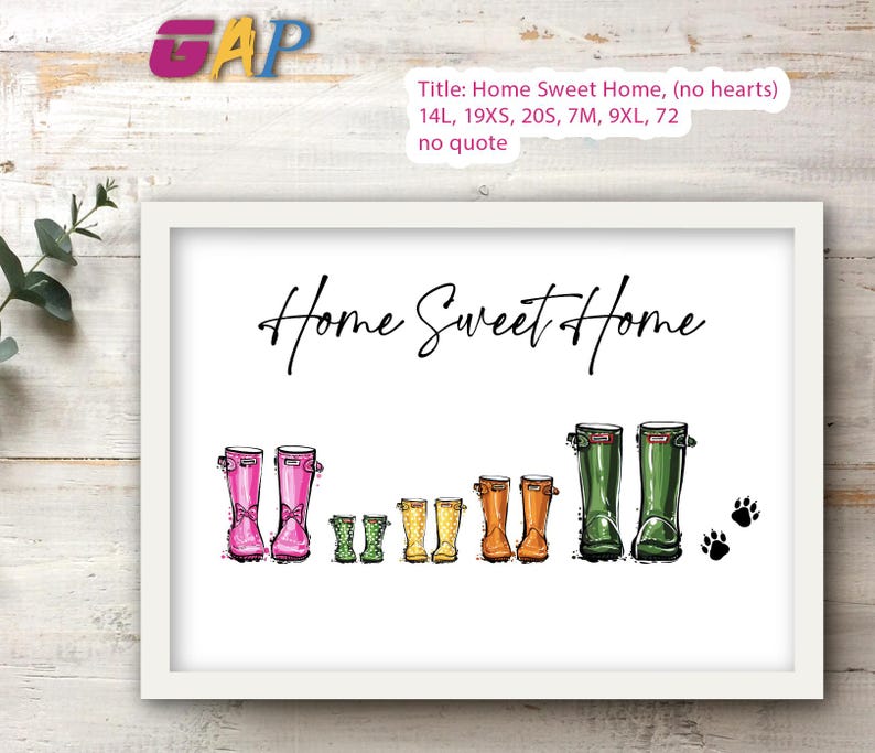 May include: A framed print featuring the text Home Sweet Home in black script. Below the text are five pairs of illustrated rubber boots in pink, green, yellow, orange, and dark green, arranged by size from smallest to largest, with two black paw prints.