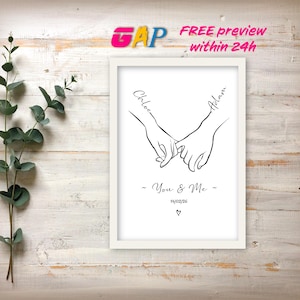 May include: A white framed print featuring a black line drawing of two hands holding pinky fingers. The names Chloe and Adam are written along the arms. Below the hands, the text reads You & Me, the date 14/02/26, and a small heart symbol.