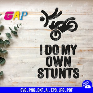 May include: Black and white graphic design of a person doing a stunt on a motorcycle with the text "I do my own stunts".
