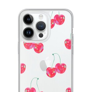 May include: A clear phone case with a pattern of red cherries on a white background. The case is designed for an iPhone with a triple camera lens.