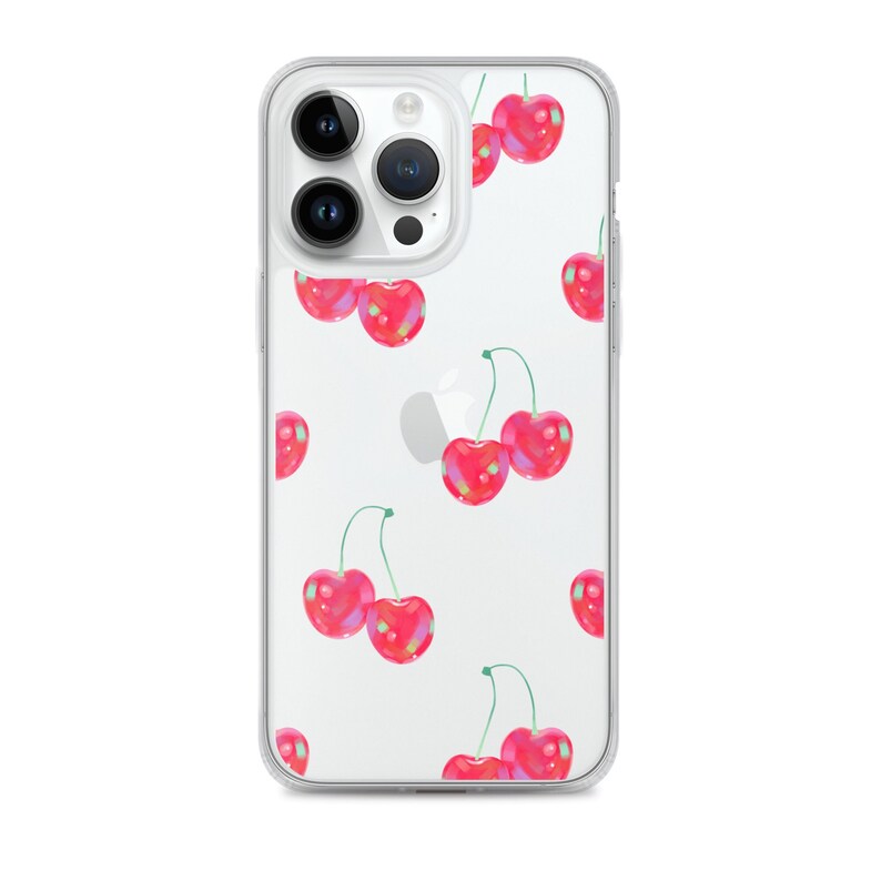 May include: A clear phone case with a pattern of red cherries on a white background. The case is designed for an iPhone with a triple camera lens.