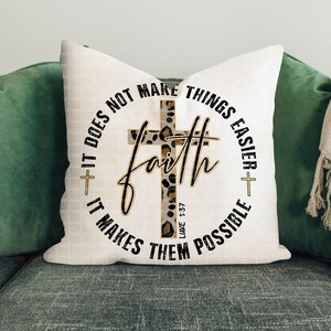 May include: White throw pillow with a black and gold circle design featuring a cross with a leopard print pattern. The text reads "Faith does not make things easier + it makes them possible" and "Luke 1:37".