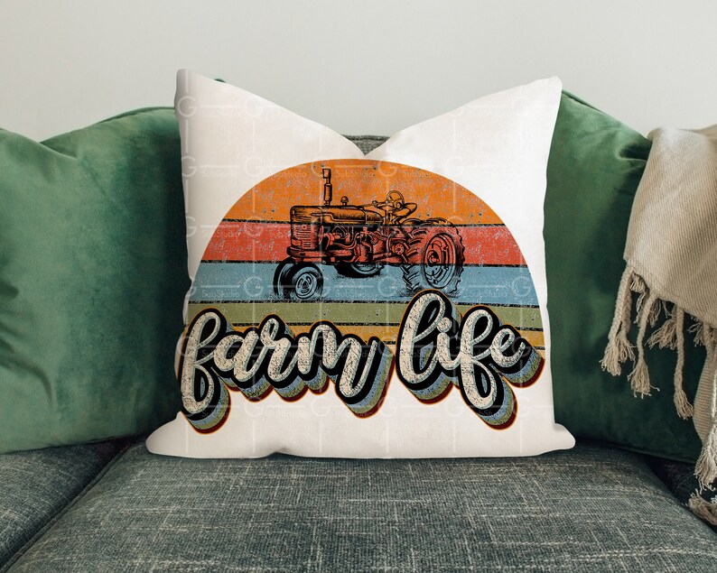 May include: White throw pillow with a vintage-style graphic of a red tractor driving through a sunset with the text "farm life" in a retro font.