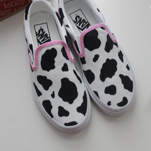Vans cow on sale print slip on