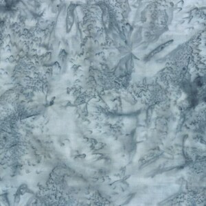 May include: A blue and white fabric with a tie-dye pattern. The fabric has a soft, flowing texture and a subtle sheen.