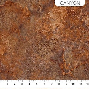 May include: A close-up of a textured, brown, and orange fabric with a subtle marbled pattern. The fabric has a rough, rustic look, reminiscent of canyon rock.