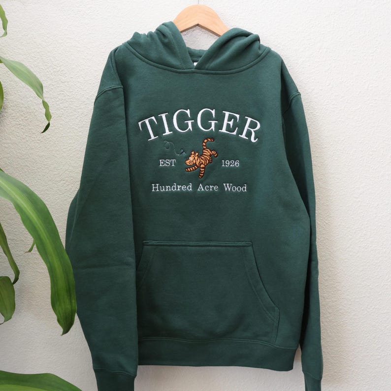 Tigger embroidery on a Alpine Green youth hoodie