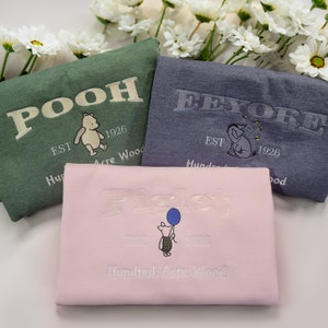 Classic Winnie The Pooh Collection | Embroidered Crewneck Sweater Featuring Pooh, Eeyore, and Piglet