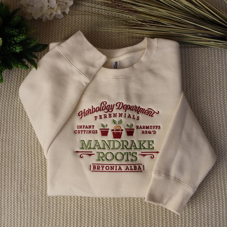 Mandrake Roots embroidery on an adult crewneck
