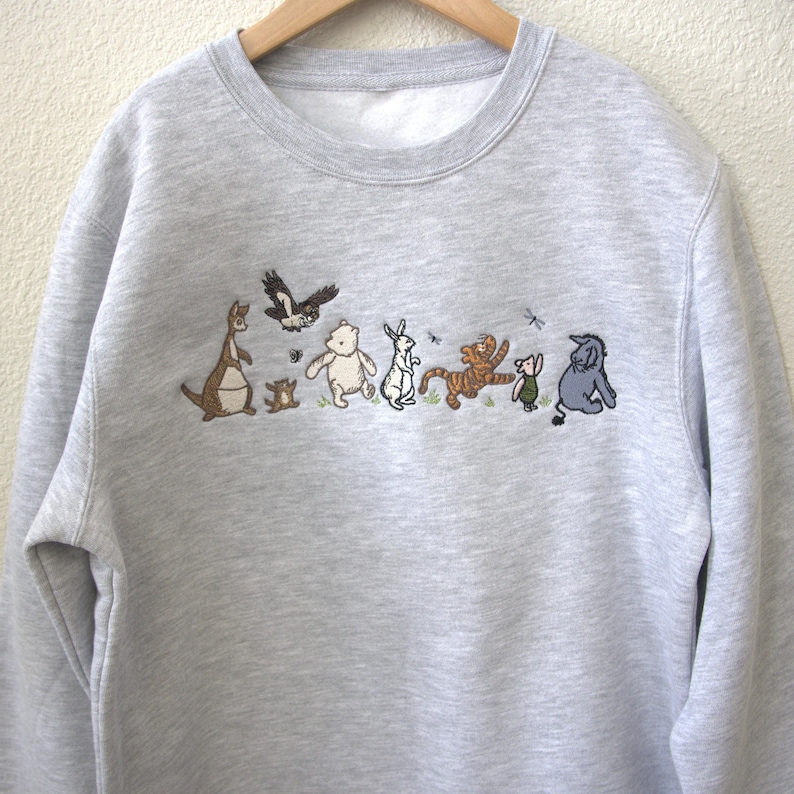 All Characters embroidery on a youth crewneck