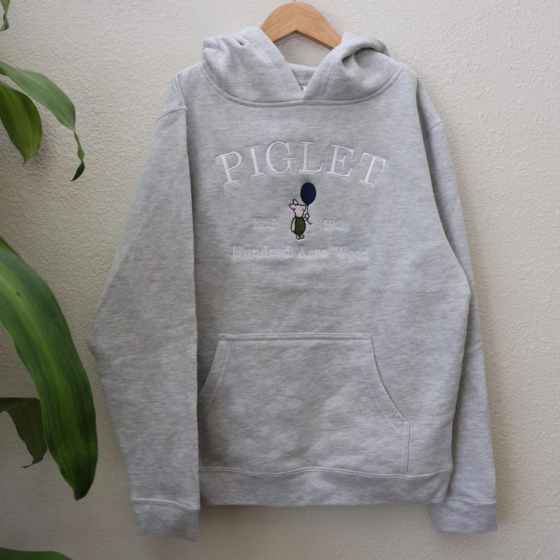 Piglet embroidery on a Grey Heather youth hoodie