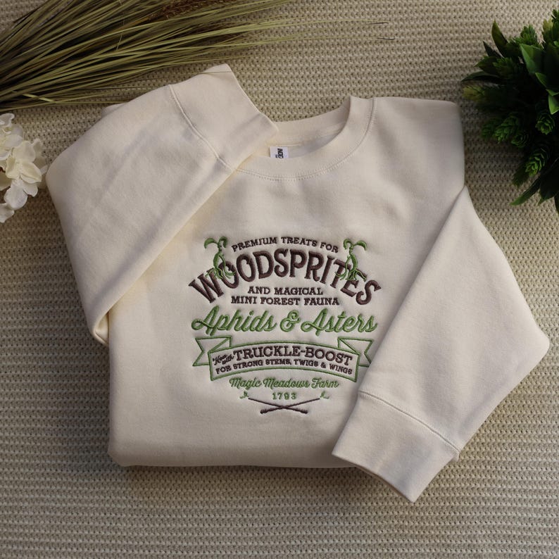 Wood Sprites embroidery on an adult crewneck