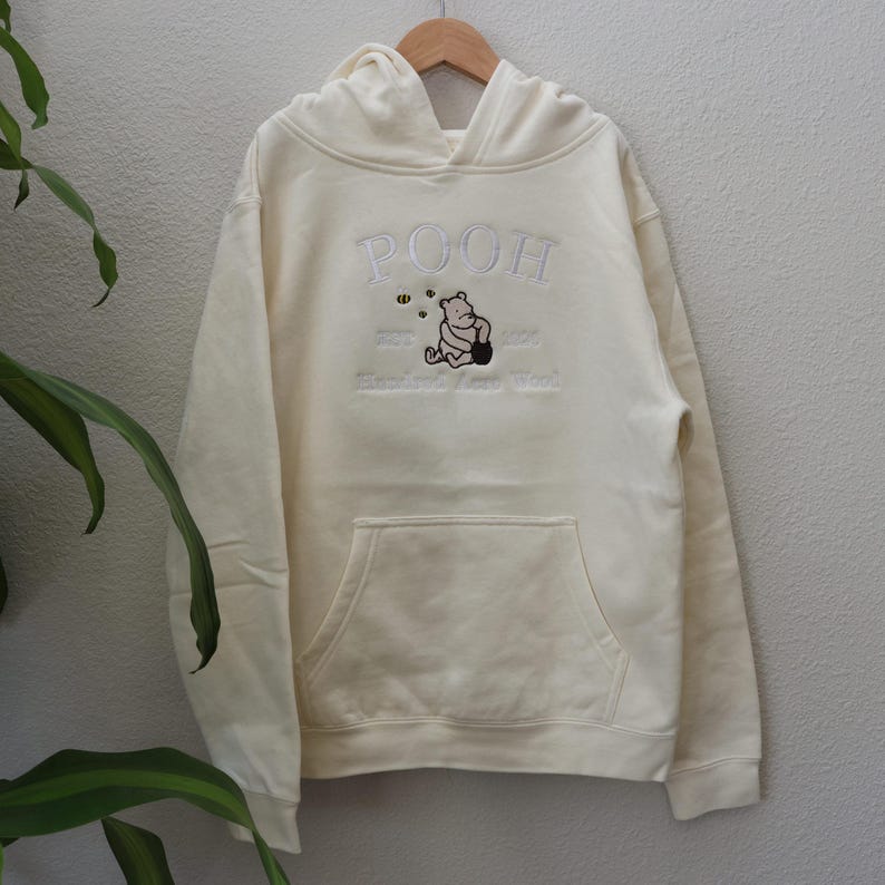 Pooh embroidery on a Bone youth hoodie