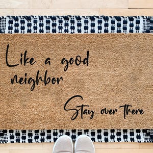 Like A Good Neighbor Stay Over There. Funny coco front door mat