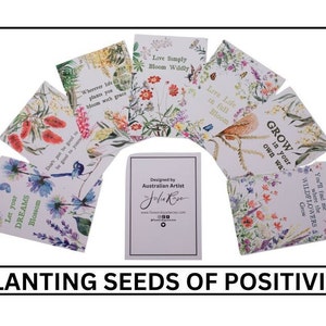 May include: A set of eight seed packets featuring watercolour illustrations of flowers and birds. Each packet includes a positive affirmation, such as "Let your dreams blossom" and "Grow in your own way". The packets are designed by Australian artist Julia Rose.