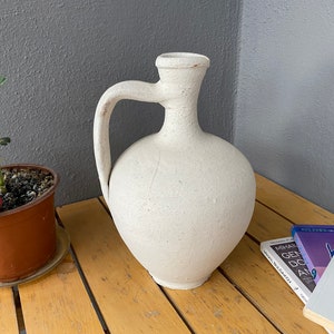 Old Clay Jug, Aged and antiqued clay vessel / vase / pot