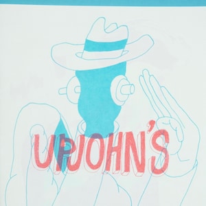 May include: A blue line drawing of a person wearing a hat with the word "UPJOHN'S" written in red and pink letters.
