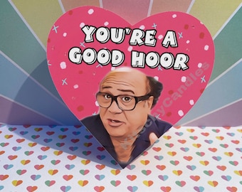 May include: A pink heart-shaped card with the text "You're a good hoor" and a picture of the character Frank Reynolds from the show "It's Always Sunny in Philadelphia".