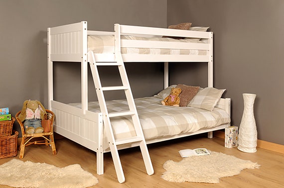 white wooden triple bunk bed