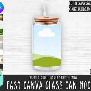 May include: A mockup of a glass can with a wooden lid and a straw. The can has a blue background with a white cloud and green hills. The text "EASY CANVA GLASS CAN MOCKUP" is at the bottom of the image. The text "DIRECTLY EDITABLE TUMBLER MOCKUP IN CANVA" is above the text "EASY CANVA GLASS CAN MOCKUP". The text "DAS 901" is in the bottom right corner of the image.