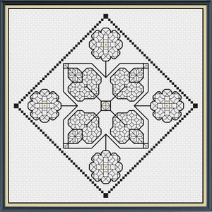 May include: A framed cross-stitch design featuring a geometric pattern in black on a white background. The design includes floral and diamond shapes, with a gold-colored center and accents. The frame is dark blue with a gold inner border.