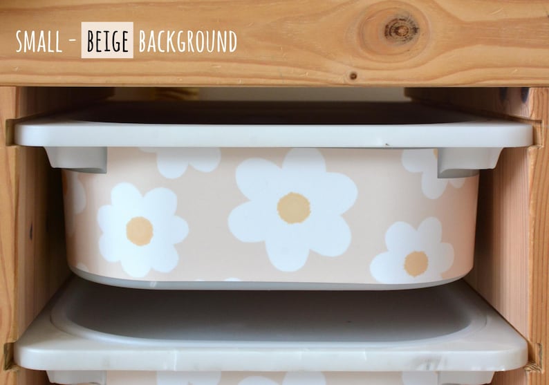 May include: A storage bin with a beige background and white daisy pattern. The bin is inside a wooden shelf. The text "SMALL - BEIGE BACKGROUND" is at the top of the image.