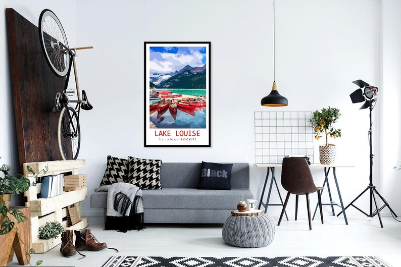 May include: A vintage travel poster featuring a scenic view of Lake Louise in the Canadian Rockies. The poster depicts a turquoise lake with snow-capped mountains in the background and red canoes docked at the shore.