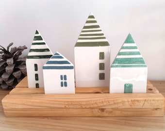 Ceramic village on wooden board