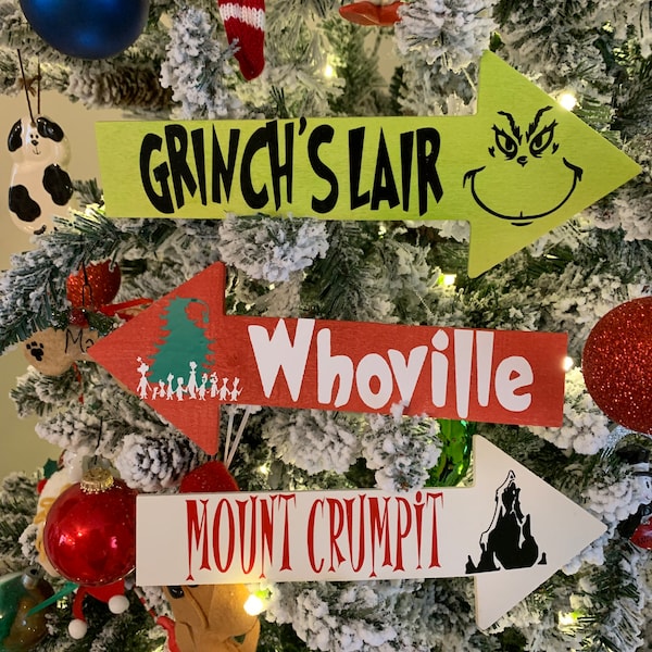 Grinch directional sign- grinch’s lair, whoville, and mt.crumpit with candy cane post