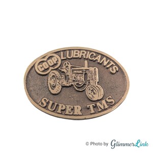 Vintage Farmland Ind John Deere Tractor Lubricant Oval Brass Belt Buckle