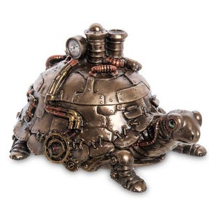 May include: A steampunk-style turtle figurine in bronze and copper tones. The turtle features intricate mechanical details, including pipes, rivets, and a pressure gauge. The figurine has a hinged shell and is designed to be a decorative box.