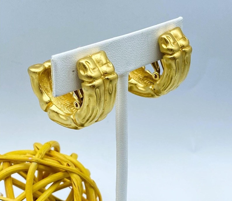 80s Givenchy bamboo half hoop clip on earrings in matte gold tone finish