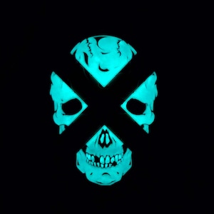 May include: A glowing turquoise skull with a black X over the eyes. The skull is a graphic design element.