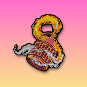 May include: An embroidered patch featuring a maroon trash can with yellow geometric details, engulfed in bright yellow and orange flames at the top, with swirling grey smoke clouds emanating from the sides, all outlined in a thick black border.