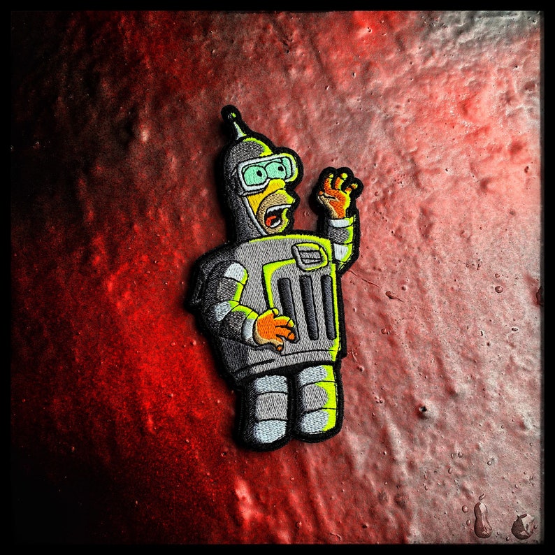May include: A robot with a yellow head and a silver body is waving. The robot has a large, silver, rectangular body with a grill-like pattern. The robot is wearing a silver helmet with a visor and has a yellow beak-like nose. The robot is set against a red background.