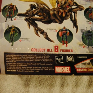 May include: Marvel action figure packaging featuring various characters, including Captain America and Black Knight. The packaging displays the text "COLLECT ALL 8 FIGURES" and the Marvel and Hasbro logos.
