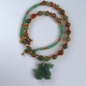 Carved Green Dragon Pendant on Green and Honey Colored Necklace with Crystal Accents