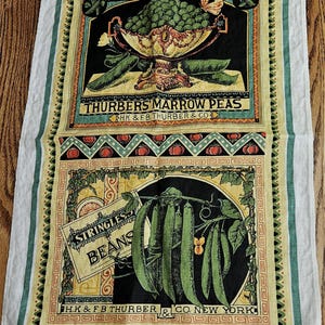 May include: A vintage-style kitchen towel featuring illustrations of vegetables. The top section displays a bowl of peas, and the bottom section shows string beans. The towel has a white background with green and yellow borders, and text that reads "THURBERS MARROW PEAS" and "STRINGLESS BEANS."