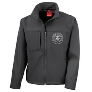 May include: Black softshell jacket with a zip fastening and a white embroidered logo on the left chest. The logo is a circle with a design inside.