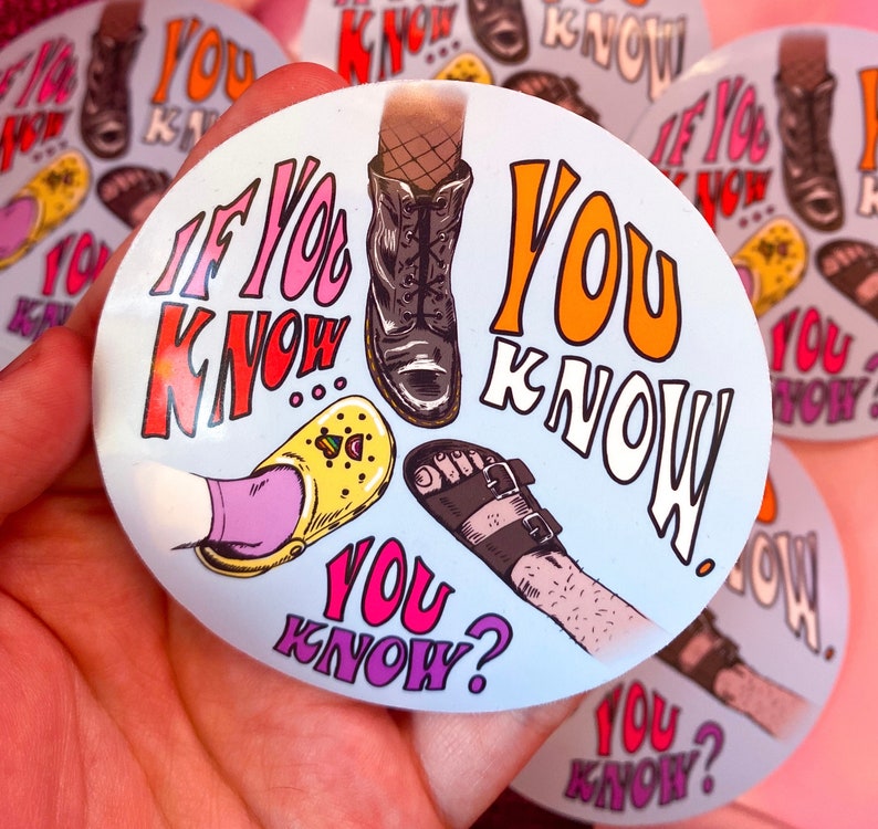 May include: A round sticker with the text "IF YOU KNOW YOU KNOW" in a retro font. The sticker features illustrations of different types of footwear, including boots, sandals, and clogs. The background is a light blue color.