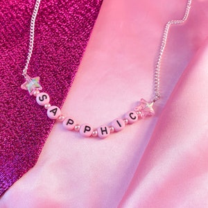 SAPPHIC necklace, cute light pink letter bead necklace with iridescent star charms, sapphic WLW pride statement necklace