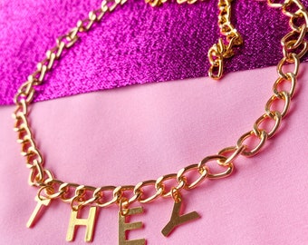 THEY lettering golden colour necklace, non binary pronoun necklace, LGBTQ+ pride statement necklace