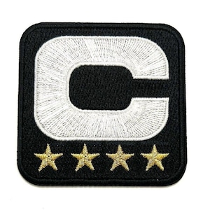 May include: Black and white embroidered patch with a white letter "C" in a circle and four gold stars below.