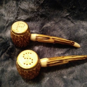 Wood pipe or maybe Corn Cob pipe these Vintage salt and peper shakers look like they could be one or the other.