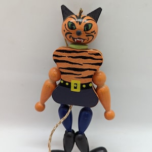 This is a wooden cat Marinette or pull toy, puppet. This black and orange stripe marionette cat would be great for Halloween. Hand painted.