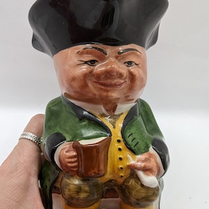 This is a Toby jug made by Woods& Sons of England. There is a number two on the bottom. Hand painted vintage jug. This is a handled jug.