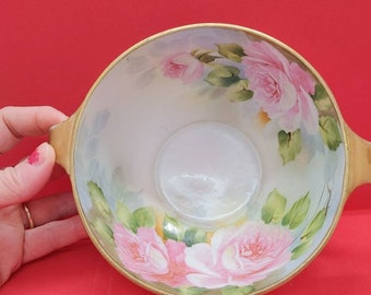 Vintage Nippon handle bowl. This is a beautiful hand painted bowl that is in perfect condition. Marked Nippon. Hand painted flowers.
