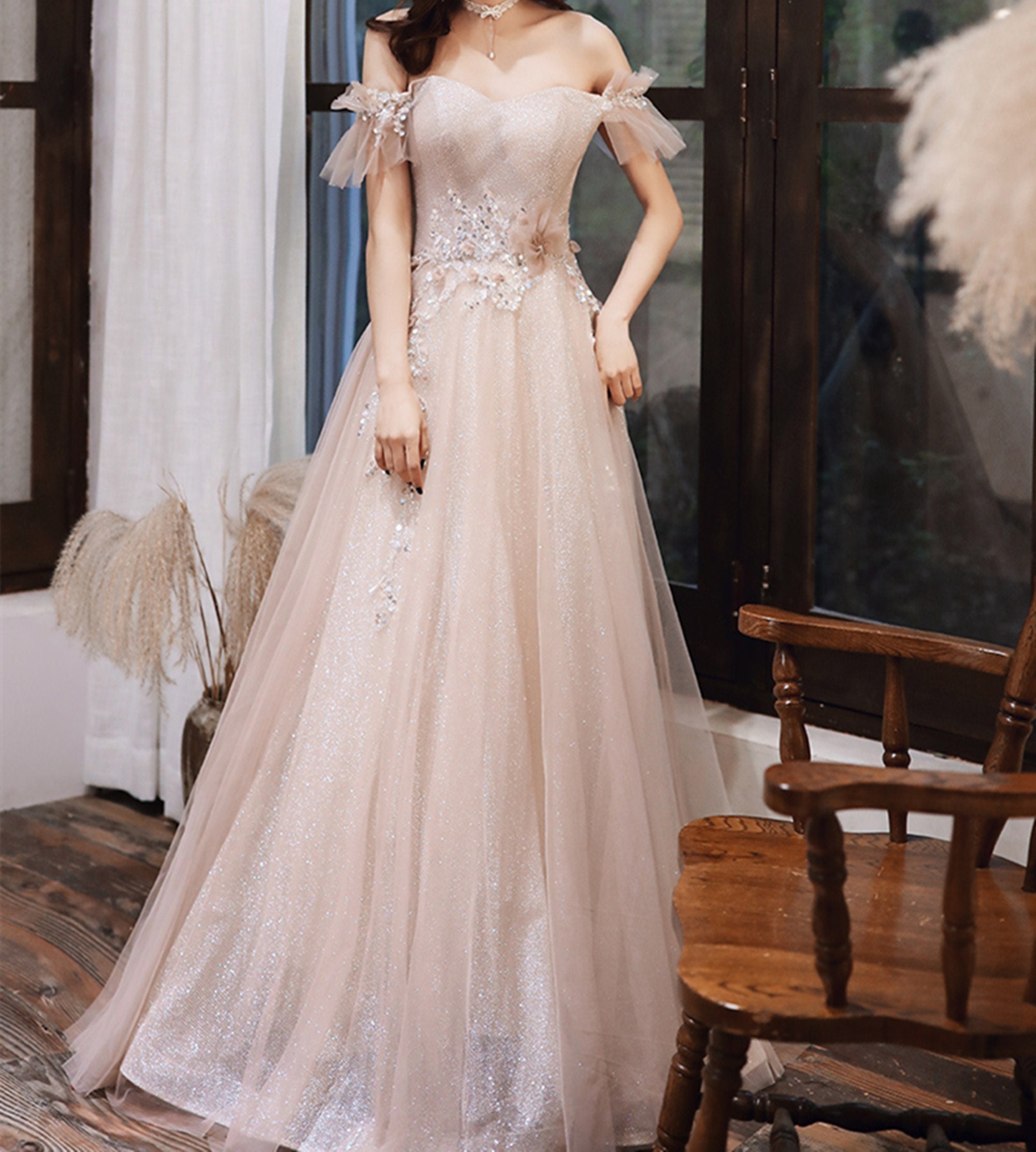 light pink ball gown with sleeves